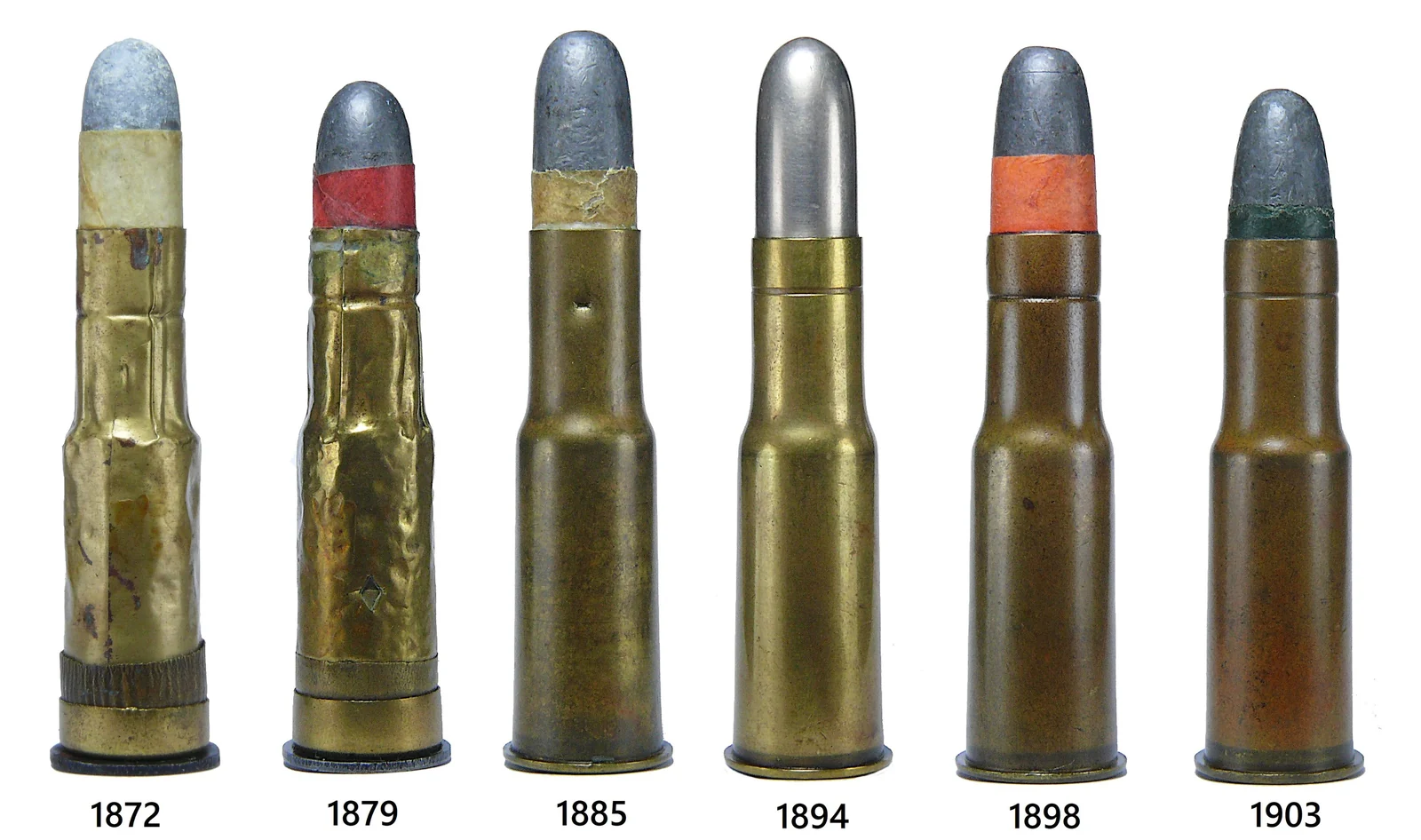 Four .577/450 Martini-Henry cartridges side by side, showing progressively different case necks, colours and bullet tips from left to right.