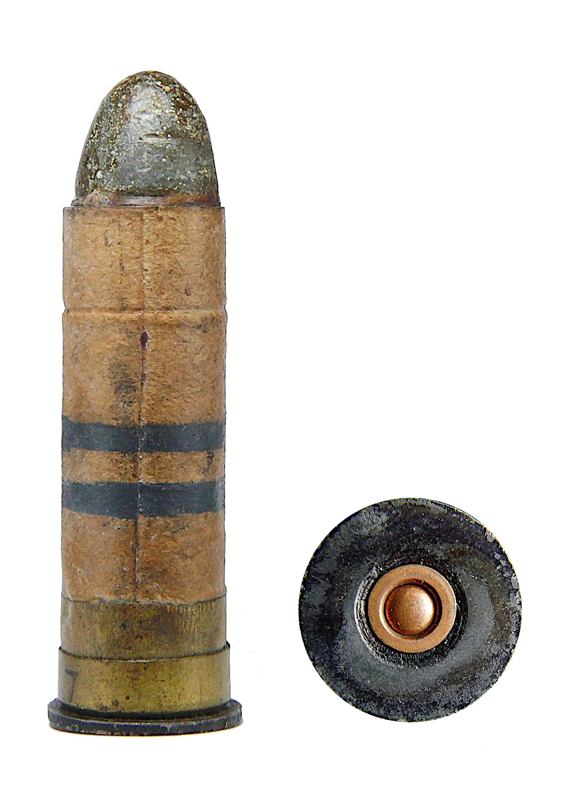 A .577 Snider cartridge with a paper-wrapped case and a rounded lead bullet, beside its own base