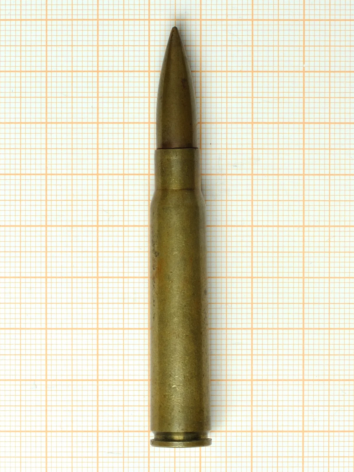 A 7.92x57mm Mauser cartridge photographed upright against a plain background