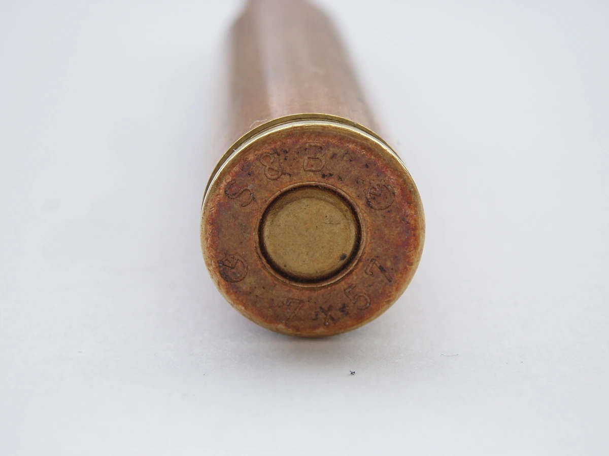 Close-up of a 7×57mm cartridge case head, headstamped S&B (Sellier & Bellot) and 7x57