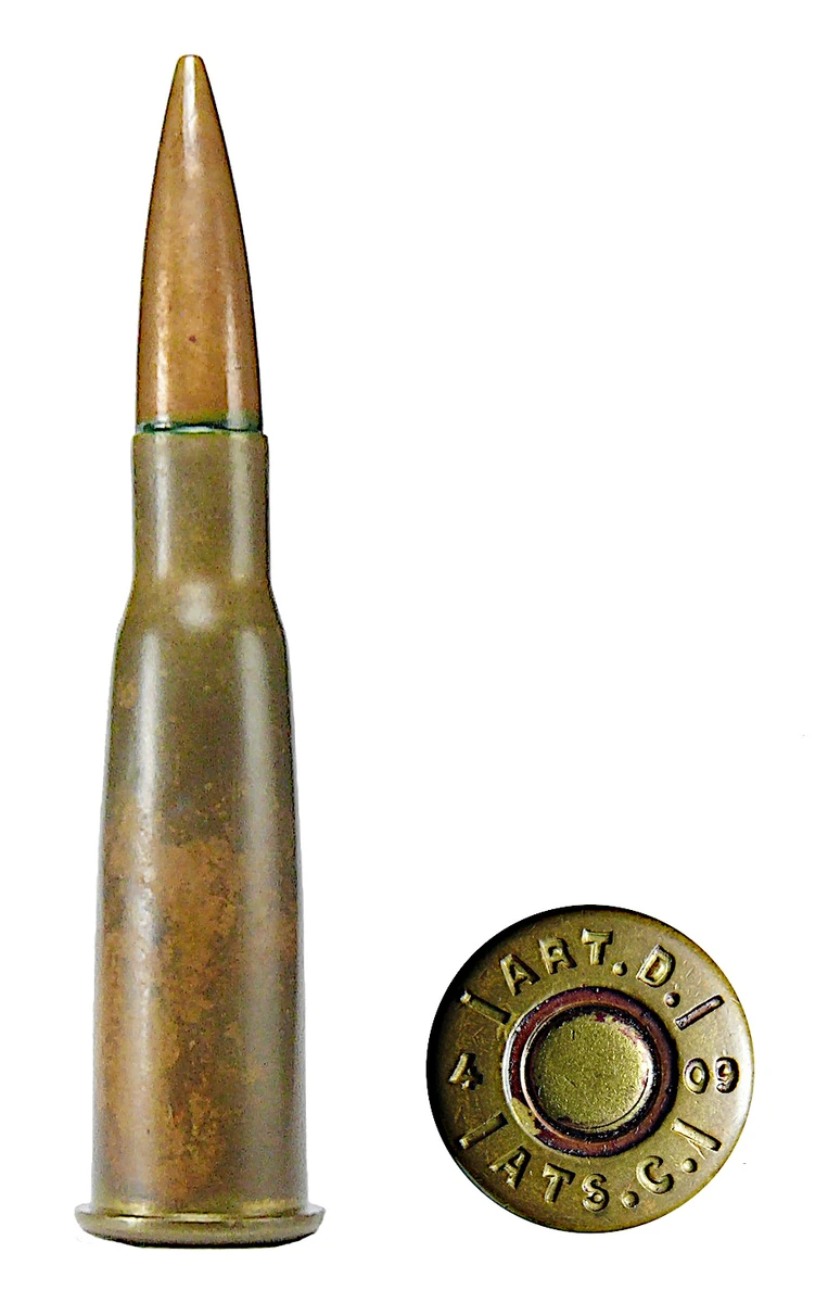An 8×50mmR Lebel Balle D cartridge next to its headstamp, reading ART.D. over ATS.C. with the numerals 4 and 09