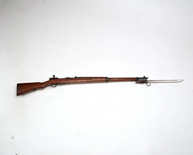 A Japanese Type 38 rifle with bayonet fixed, photographed against a plain ground