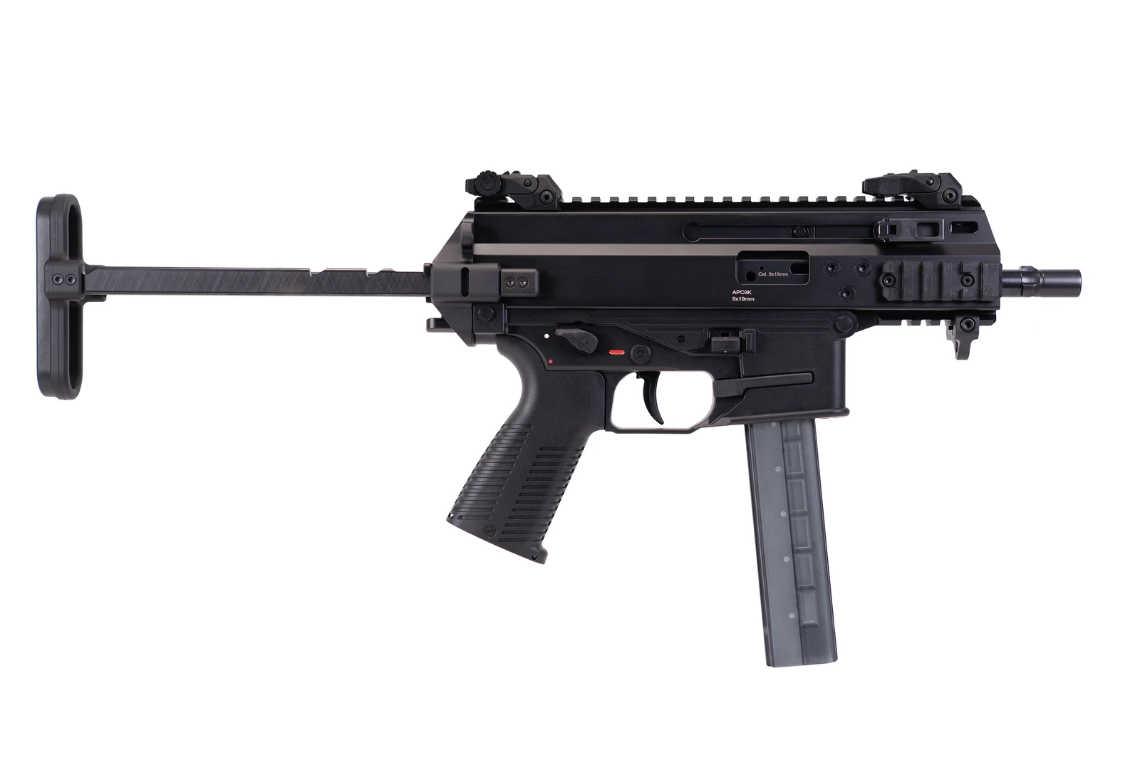 A B&T APC9 K submachine gun with folding stock and short barrel, photographed in profile against a plain ground