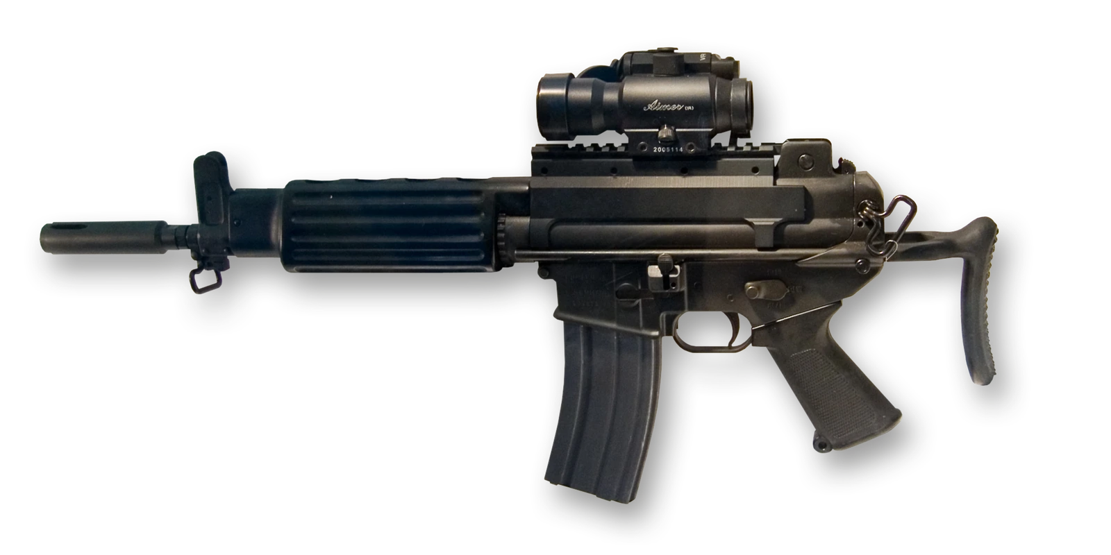 A short black carbine with a folded telescoping stock, a mounted optical sight and a curved box magazine.