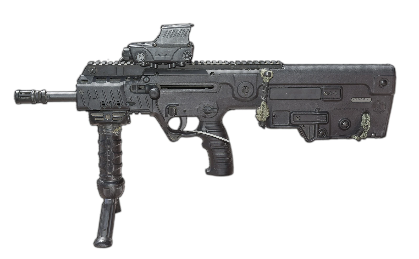 A short black bullpup rifle with a flat-top rail, a reflex sight, an angled foregrip and a bipod, standing on its own bipod legs.