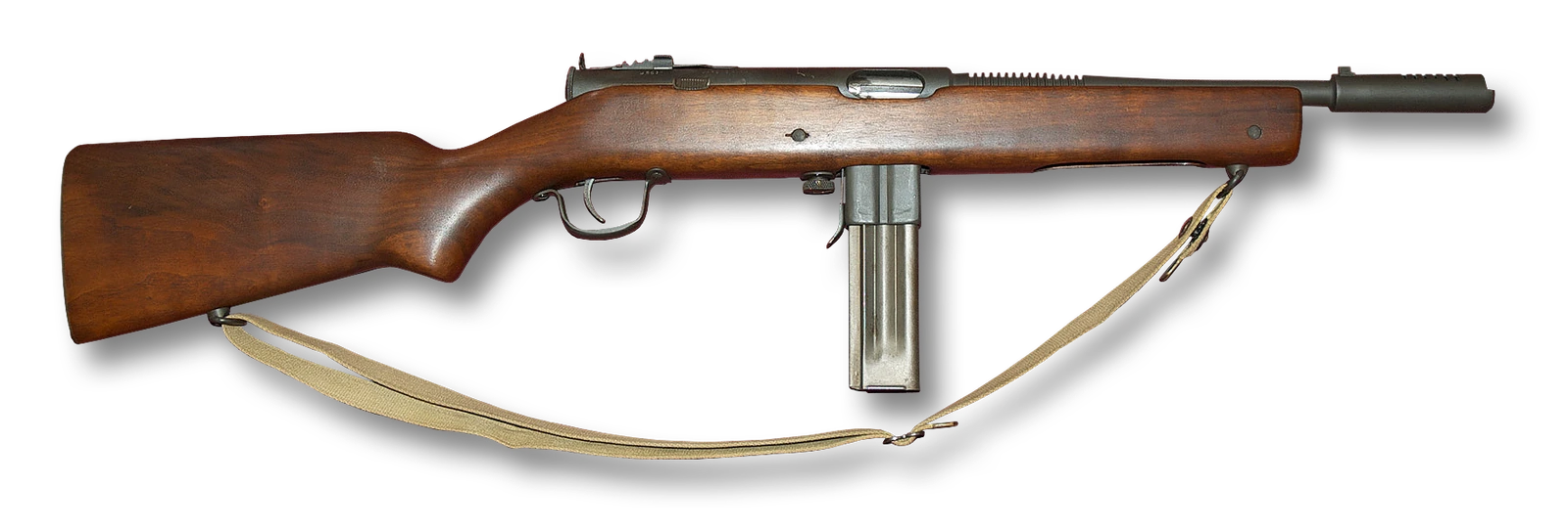A submachine gun with a wooden stock and forend, a perforated barrel jacket and a curved box magazine hanging below the receiver.