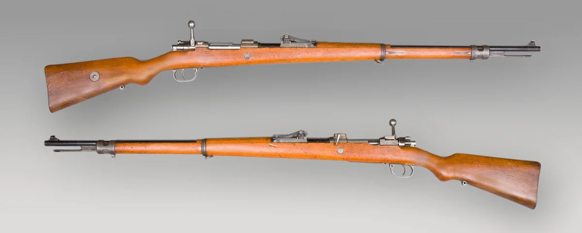 A Gewehr 98 rifle photographed against a grey background, right side