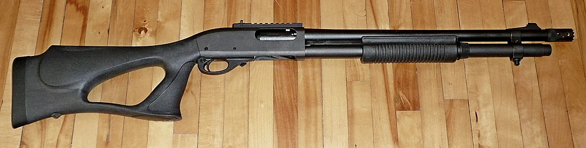 A Remington 870 Express Tactical shotgun with a short barrel and synthetic furniture