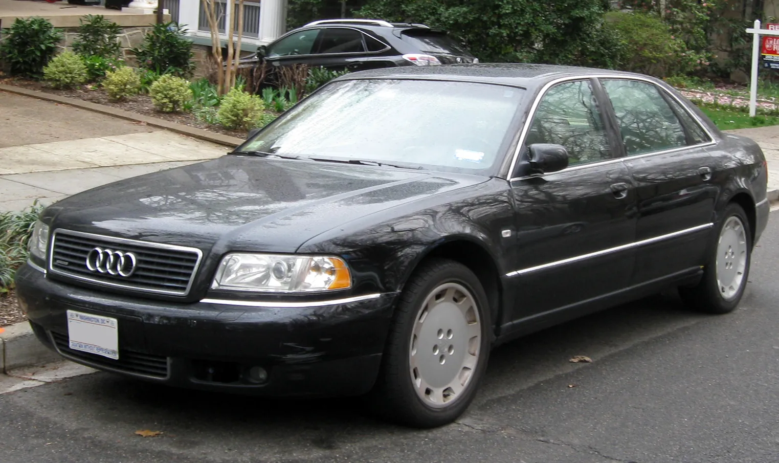 Black first-generation Audi A8 L 4.2 photographed from the front three-quarter angle