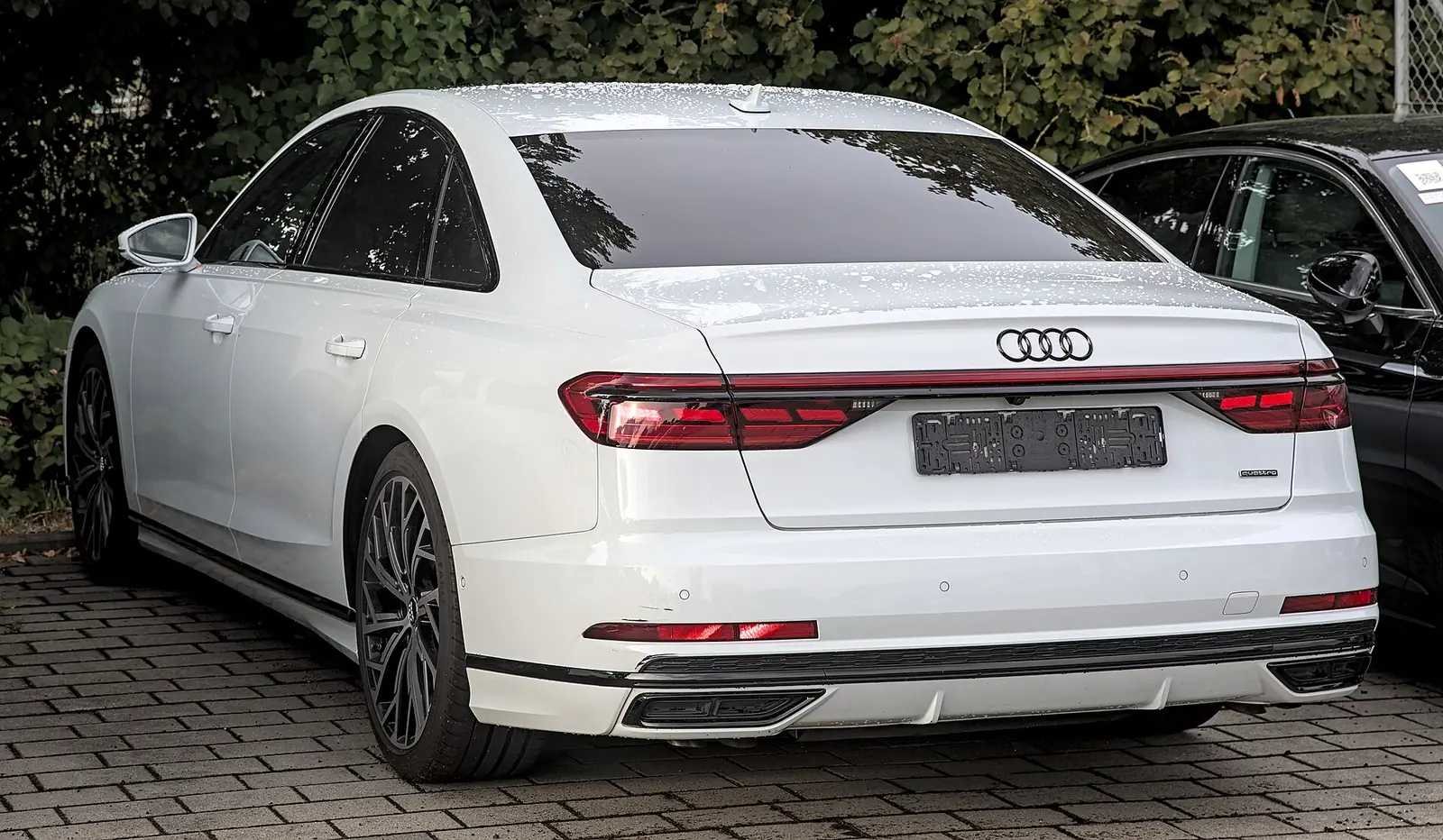 Grey fourth-generation Audi A8 photographed from the front three-quarter angle