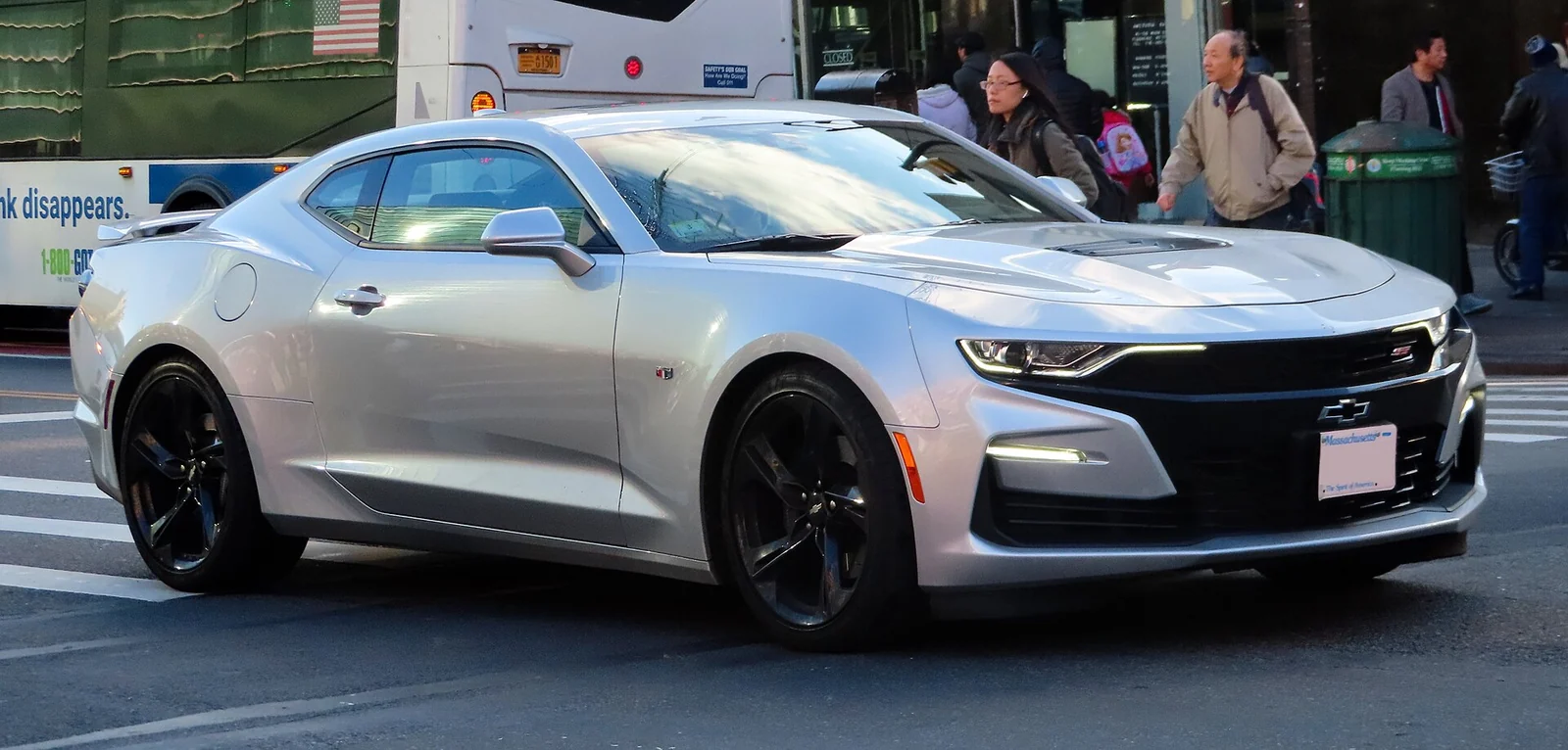 Silver sixth-generation Chevrolet Camaro 2SS photographed from the front three-quarter angle on a city street
