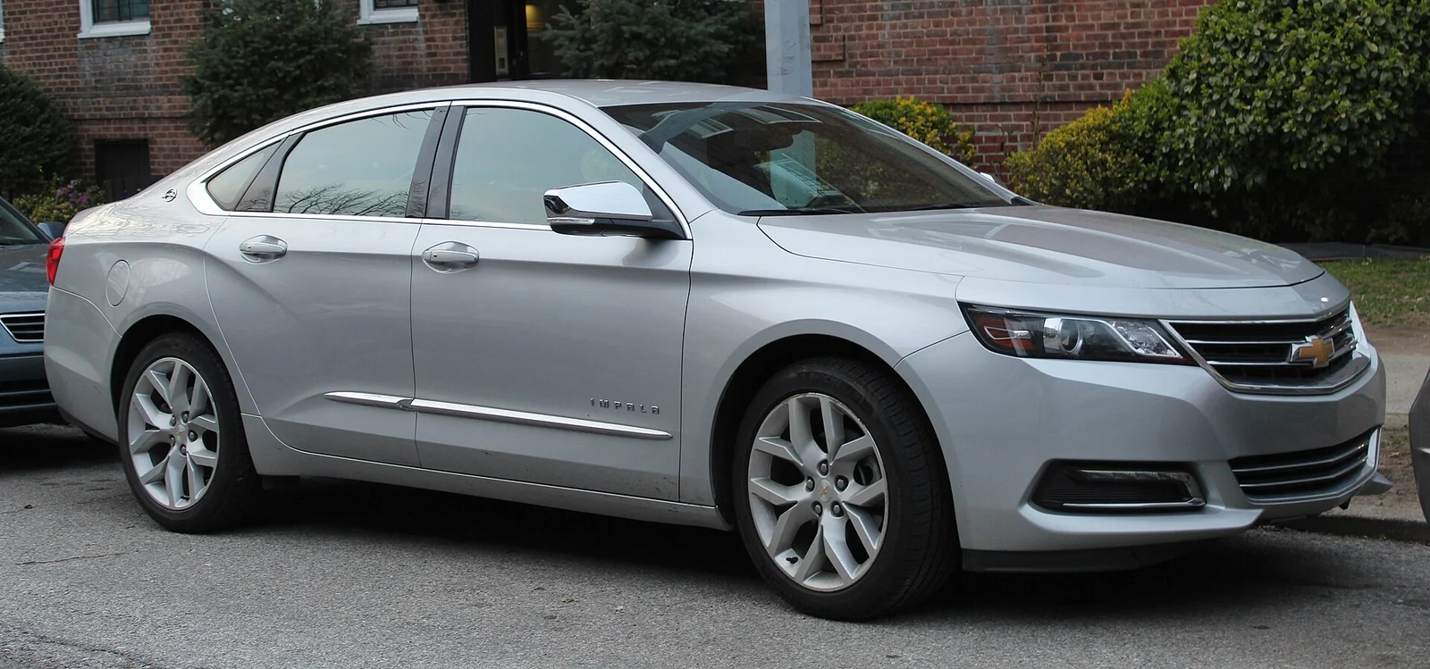 Silver tenth-generation Chevrolet Impala Premier photographed from the front three-quarter angle