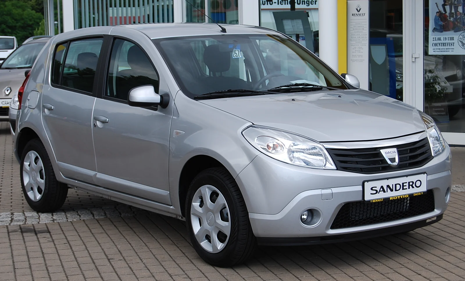Silver first-generation Dacia Sandero hatchback photographed from the front three-quarter angle