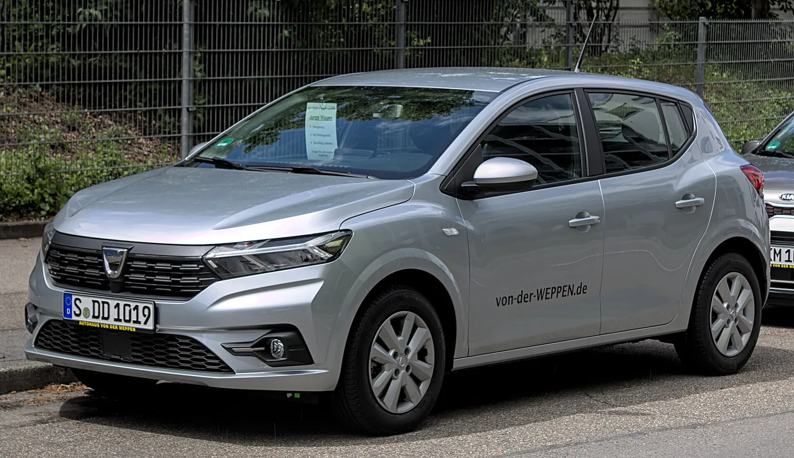 Silver third-generation Dacia Sandero hatchback photographed from the front three-quarter angle