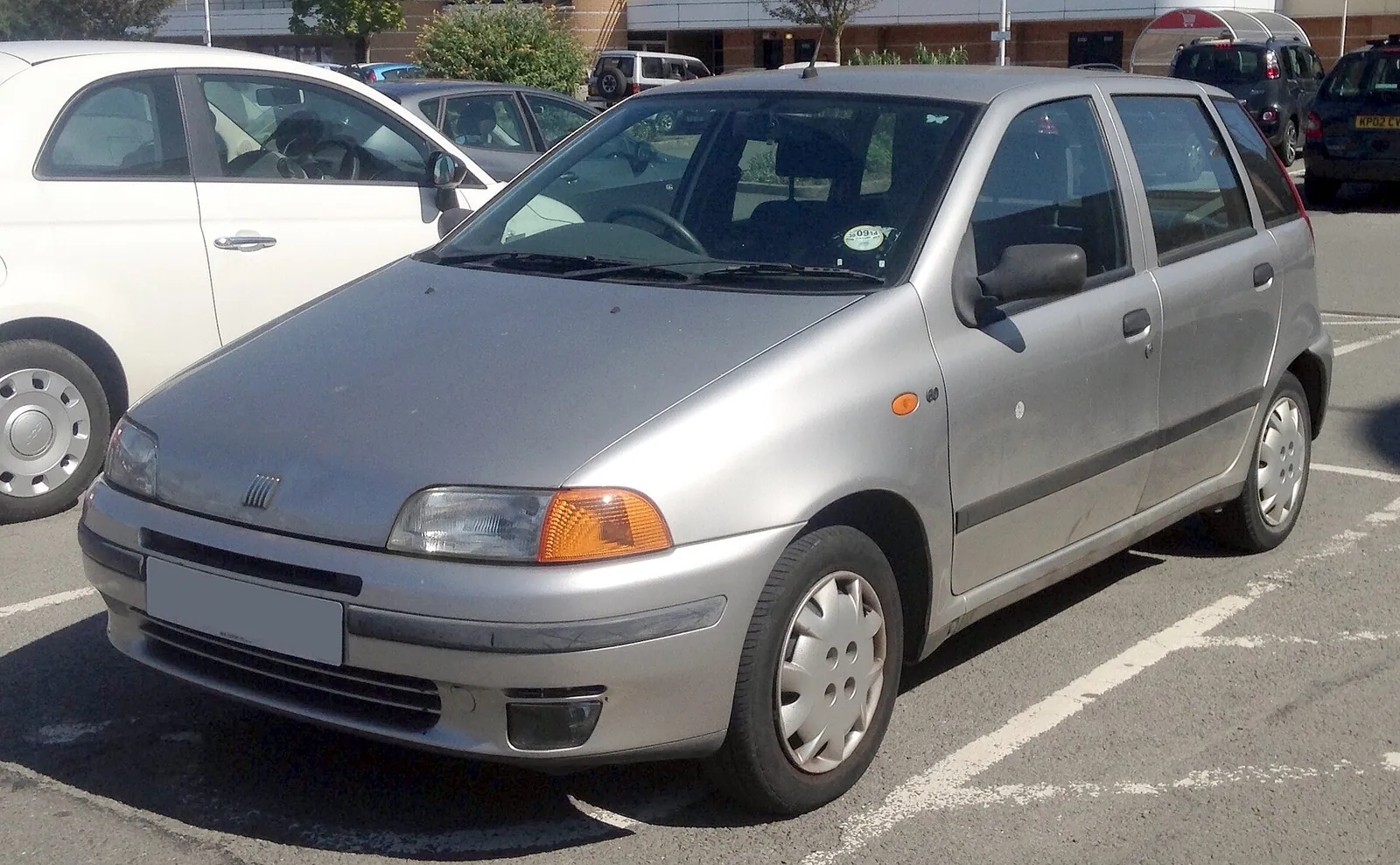 Silver first-generation Fiat Punto photographed from the front three-quarter angle, showing its rounded Giugiaro-designed hatchback body