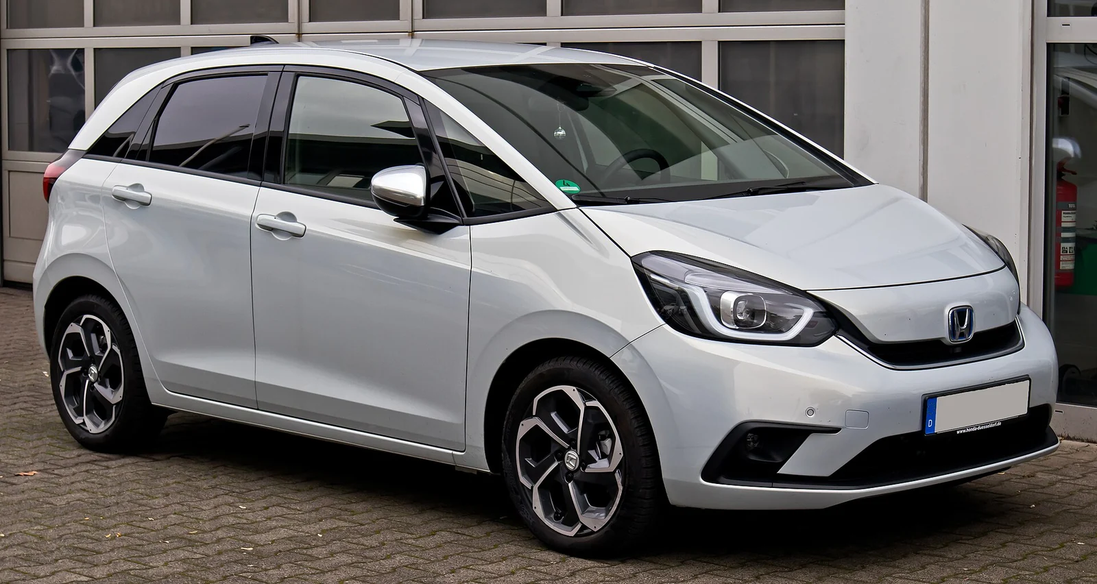 White fourth-generation Honda Jazz Hybrid Executive photographed from the front three-quarter angle
