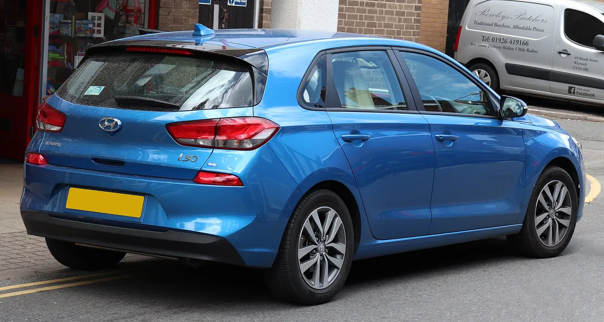 Rear three-quarter view of a blue third-generation Hyundai i30 hatchback