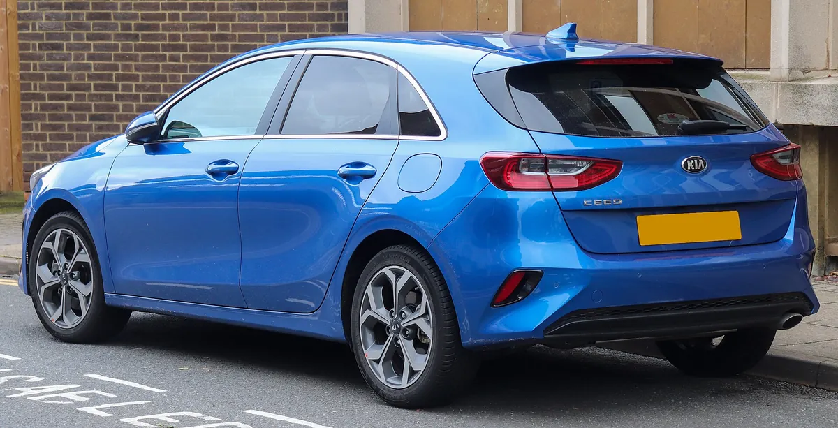 Rear three-quarter view of a blue third-generation Kia Ceed hatchback