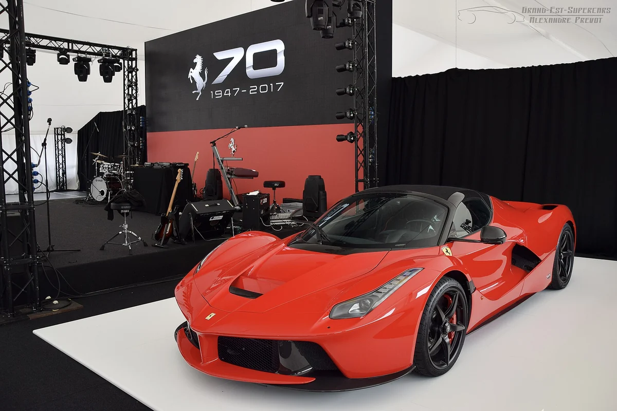 Red LaFerrari Aperta targa-top convertible on display at a Ferrari 70th anniversary event