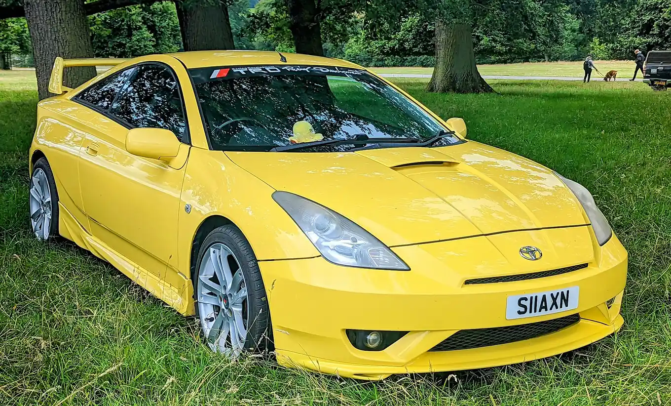 Yellow seventh-generation Toyota Celica GT VVTL-i photographed from the front three-quarter angle