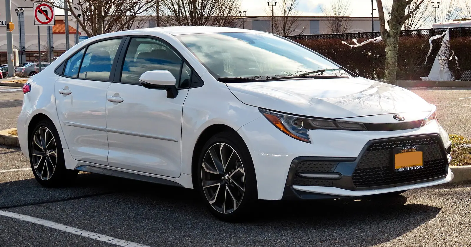 White 2020 Toyota Corolla SE saloon photographed from the front three-quarter angle