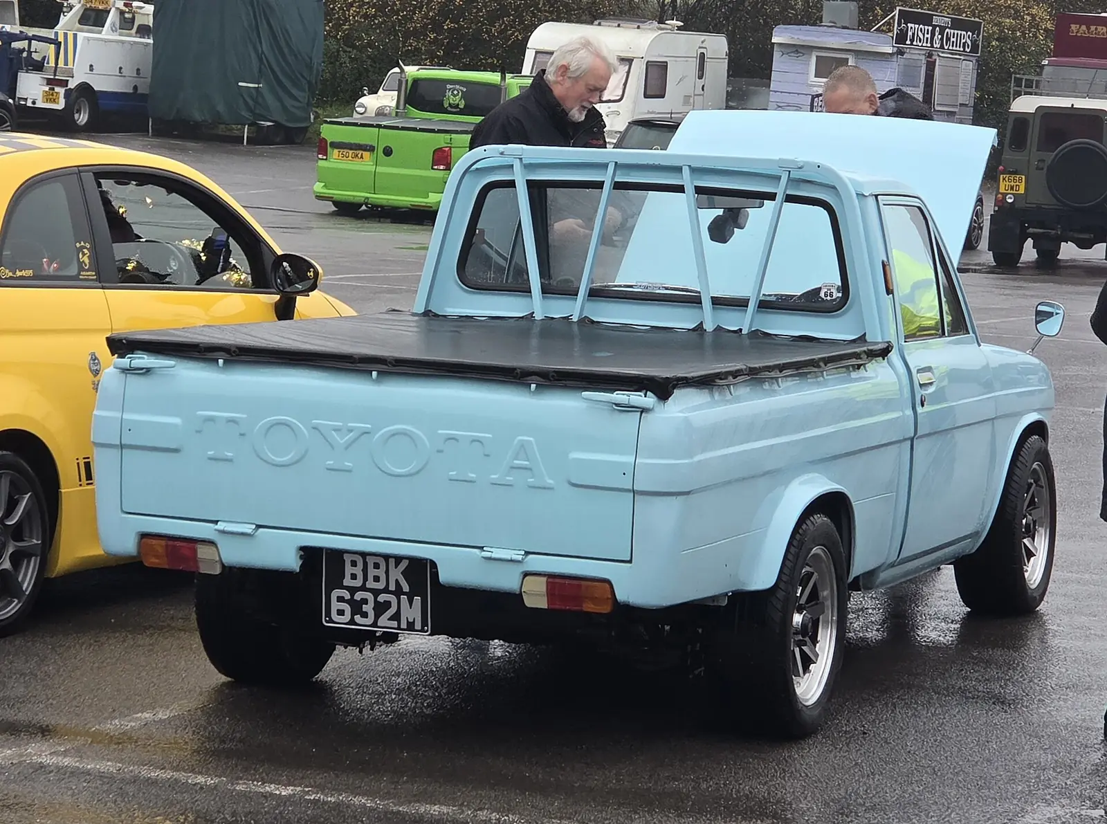 Light blue original Toyota Hilux N10 pickup truck photographed from the front three-quarter angle