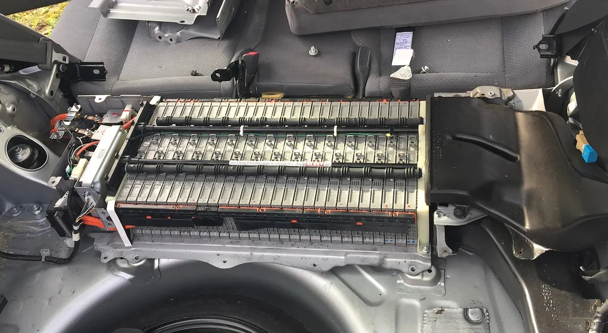 An opened Toyota Prius hybrid battery pack showing its twenty-eight rectangular nickel-metal-hydride modules connected in series