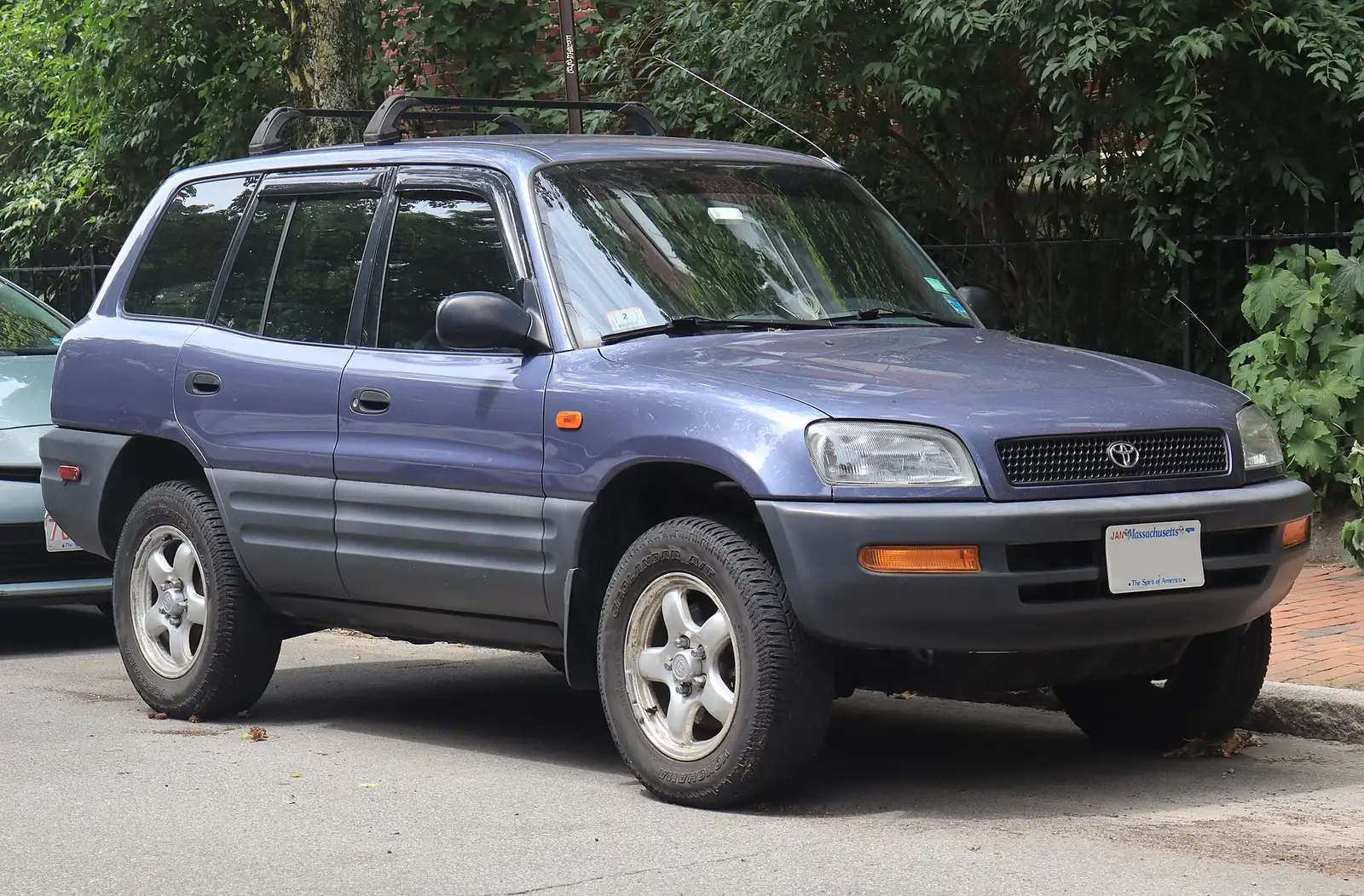 Blue/purple first-generation Toyota RAV4 five-door photographed from the front three-quarter angle