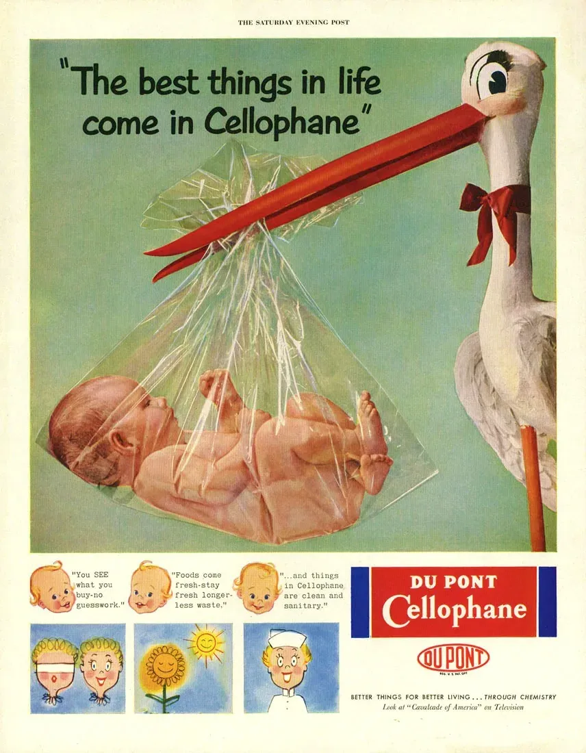 A magazine advertisement showing a stork carrying a swaddled baby in a transparent cellophane bundle, with the headline 'The best things in life come in Cellophane' and a Du Pont Cellophane logo below.