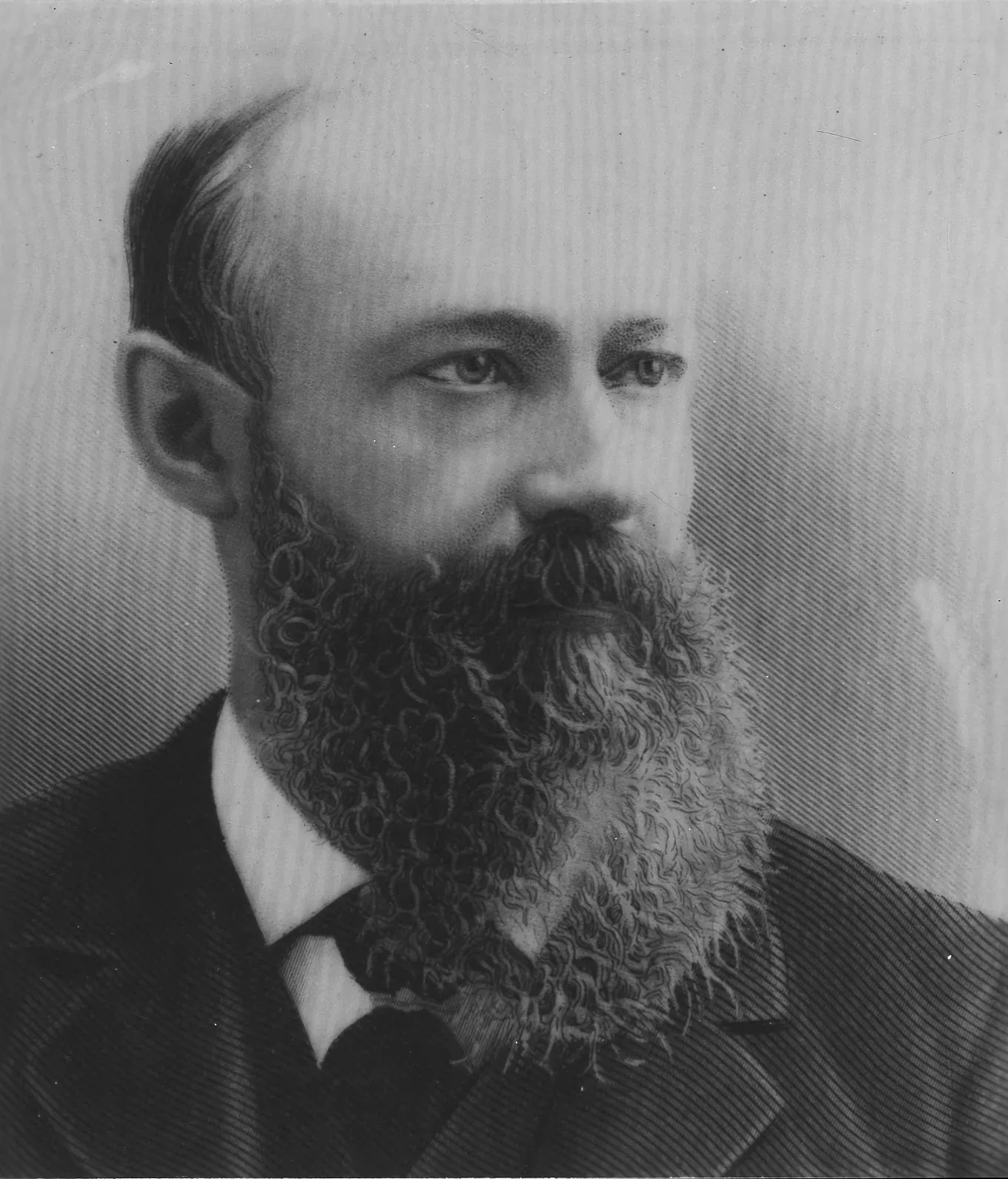 An engraved head-and-shoulders portrait of a balding, heavily bearded man in a dark suit and bow tie, looking off to one side.