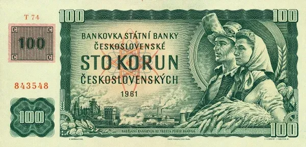 A green and cream Czechoslovak 100-koruna banknote dated 1961, bearing a small rectangular adhesive stamp overprint in its upper-left corner.