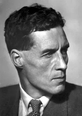 A three-quarter profile studio portrait of a man with dark, swept-back hair, in a dark suit and patterned tie, looking off to one side with a serious expression.