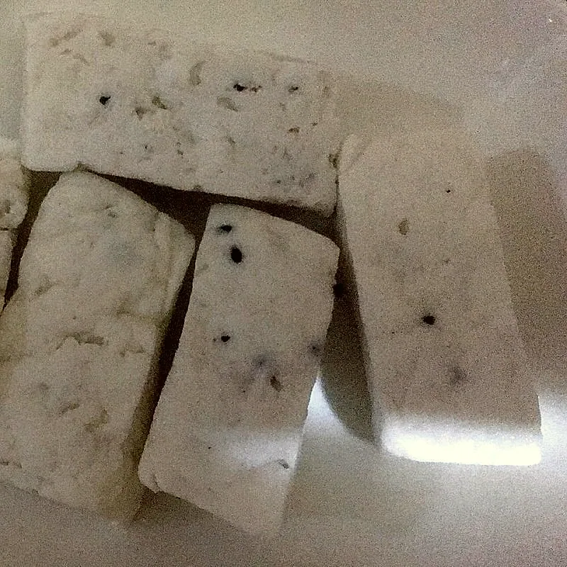 Blocks of white akkawi cheese studded with black nigella seeds