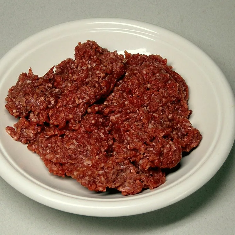 Raw minced beef on a white plate