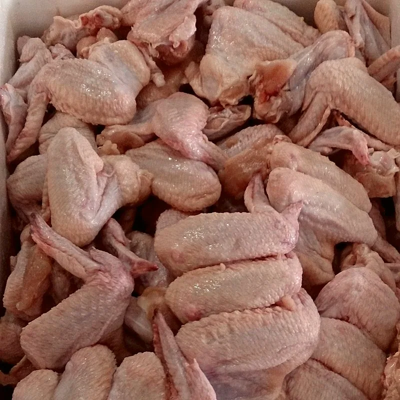 A pile of raw chicken wings