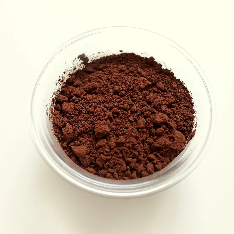 A bowl of dark brown cocoa powder
