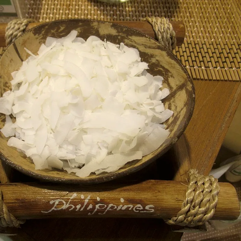 A bowl of white desiccated coconut flakes