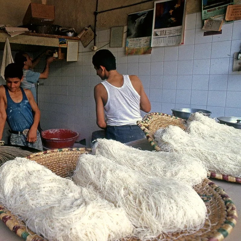 Baskets piled with raw, shredded white kadayıf pastry strands