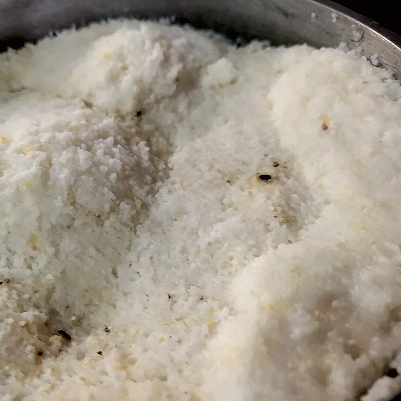 A bowl of dry, granular white maize meal