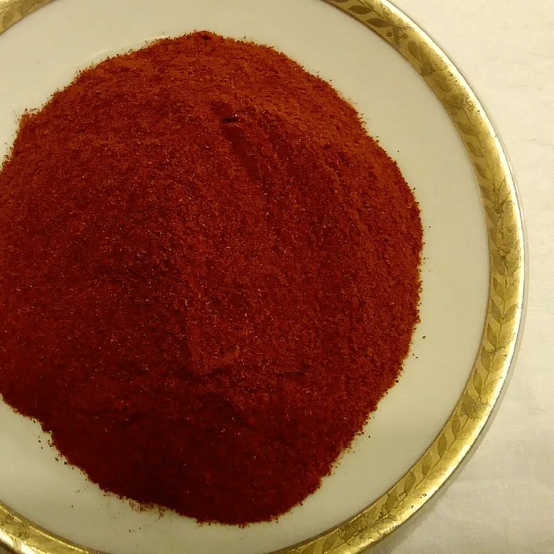 A plate heaped with vivid red ground sweet paprika