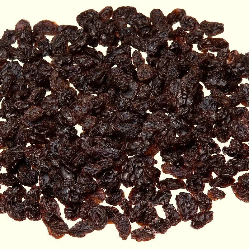 A pile of dark dried raisins