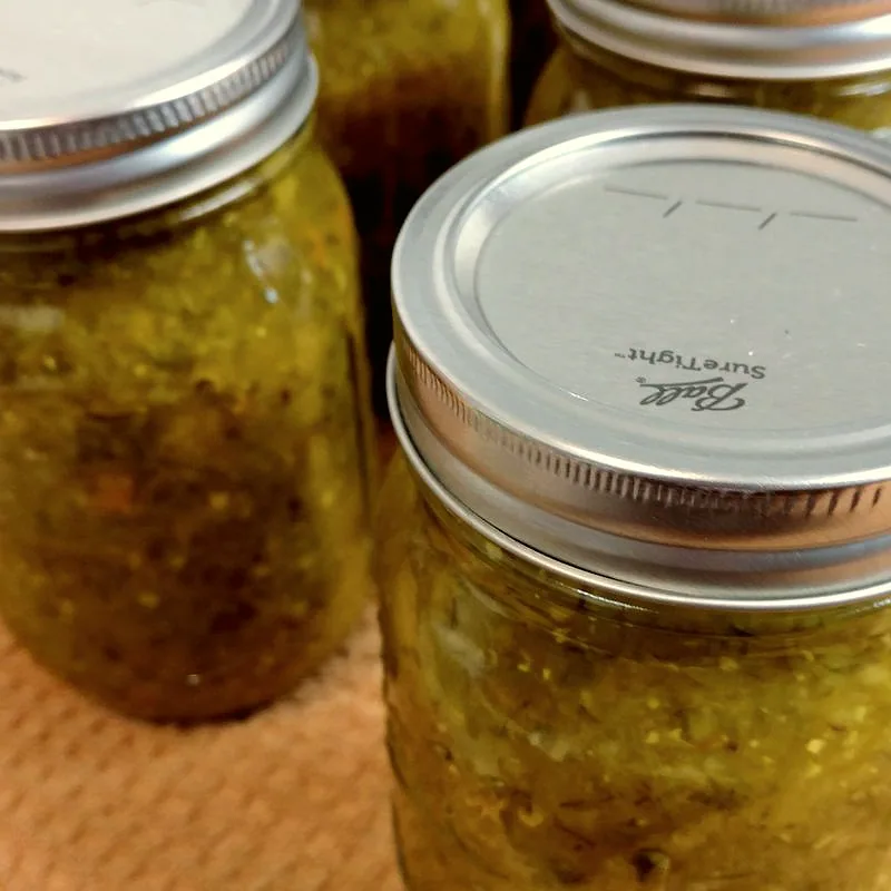Mason jars filled with chunky green pickle relish