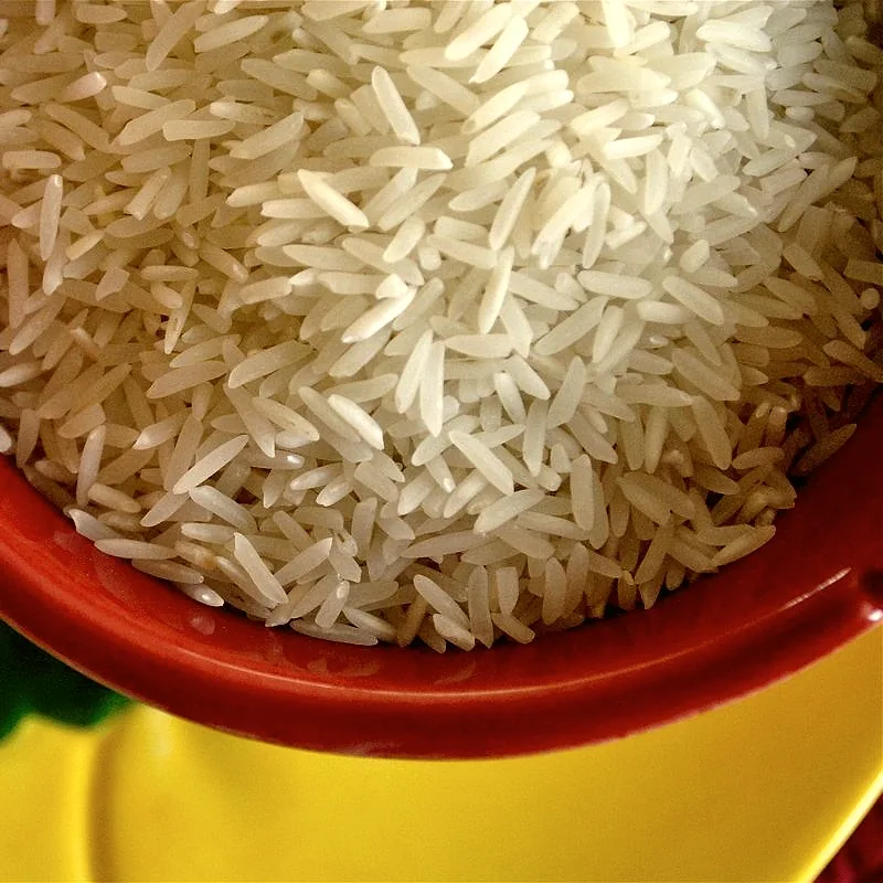 A bowl of raw white long-grain rice