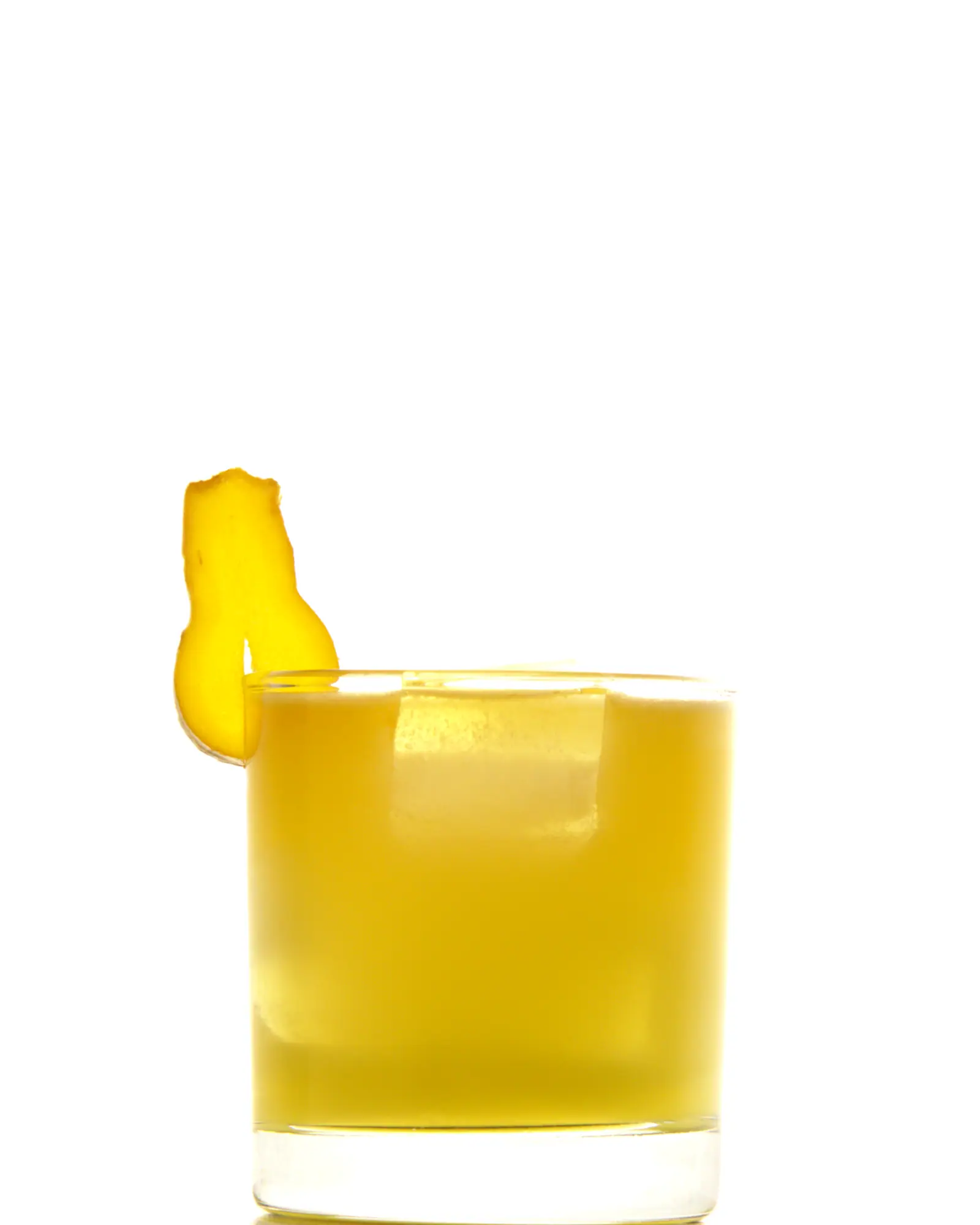 A Penicillin cocktail in a rocks glass over ice, golden in colour, garnished with a piece of candied ginger
