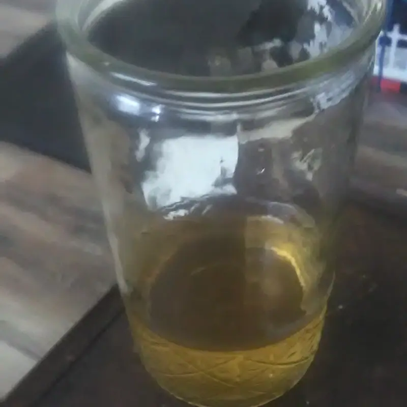 Pale gold ginger ale in a plain glass