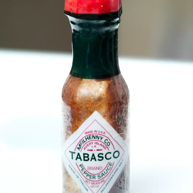 A small bottle of Original Tabasco pepper sauce, red cap and diamond label