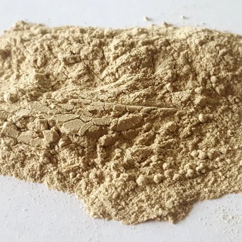 A pile of coarse ground tan kava root powder