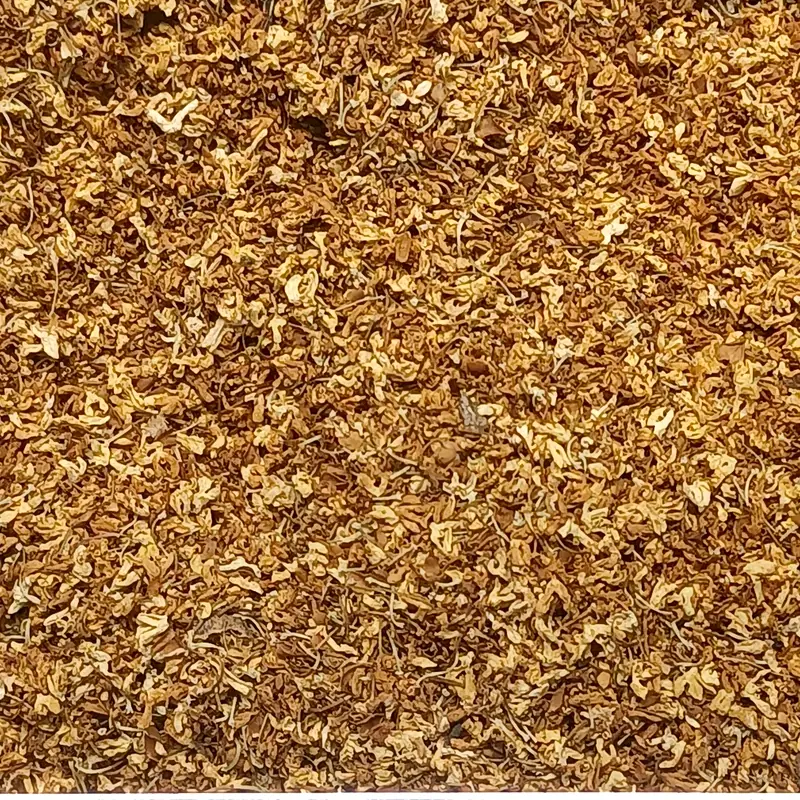 A close-up mass of small dried golden osmanthus flowers