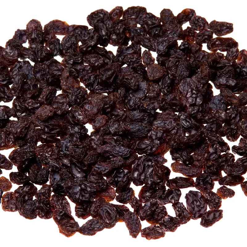 A close pile of dark dried raisins
