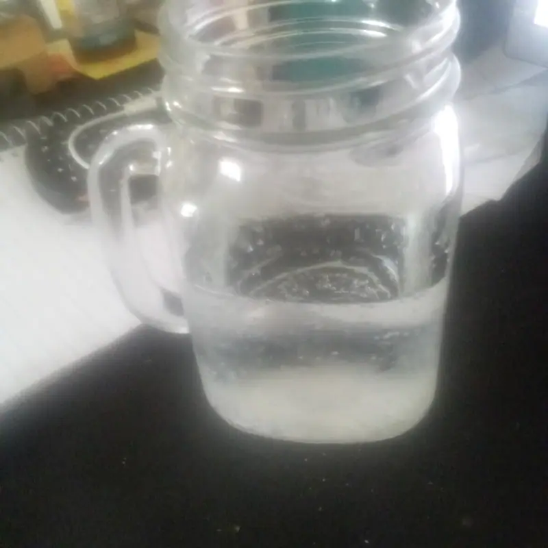 A mason-jar mug filled with clear tonic water